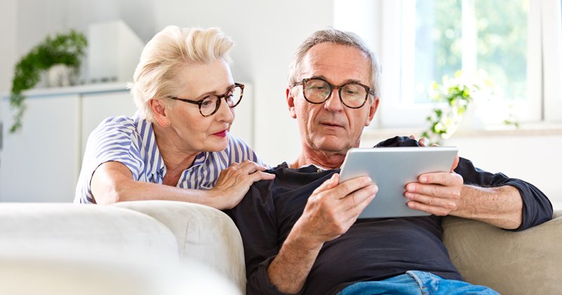Fraud article image of couple looking at a tablet